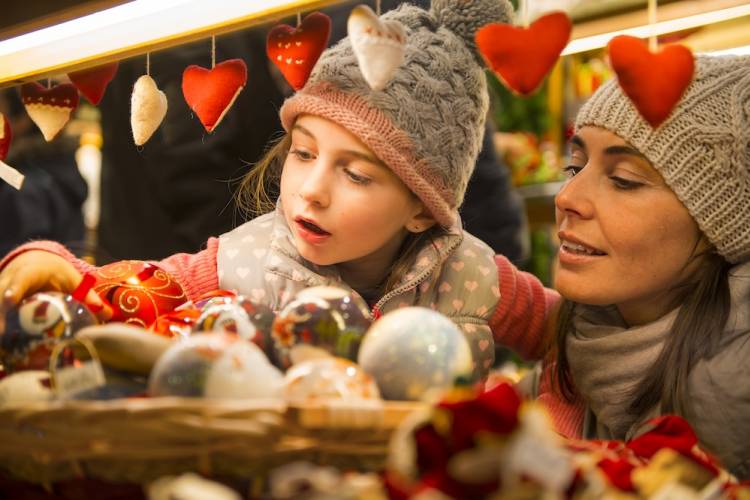 mother and daughter at a christmas market