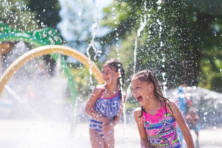 girls at a splash pad